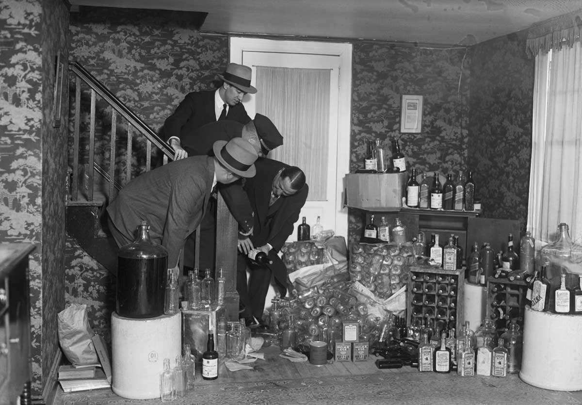 police raid home bootlegger eugene shine prohibition 1930